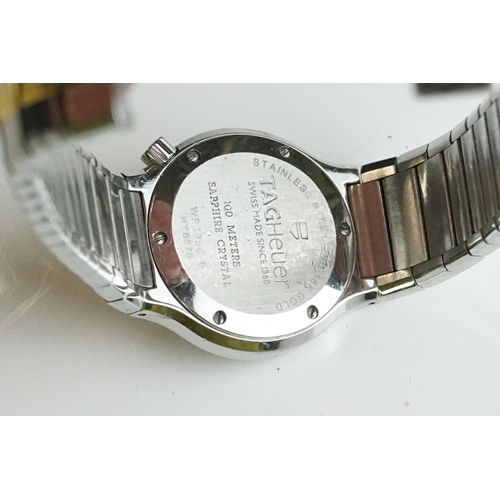 282 - A collection of gents and ladies wristwatches to include Citizen and Swatch examples.