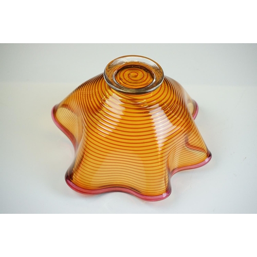 43 - Bob Crooks - Two ' Venetian ' glass bowls of lobed form, to include an amber example with ruby threa... 