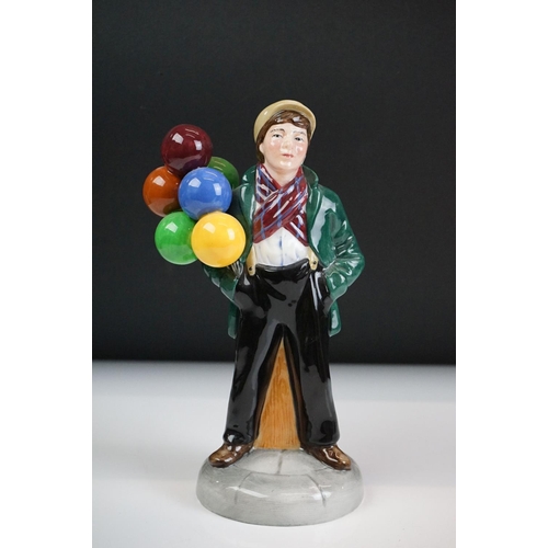 46 - Four Royal Doulton porcelain figures to include the Balloon Lady (HN 2935), The Rag Doll Seller (HN ... 