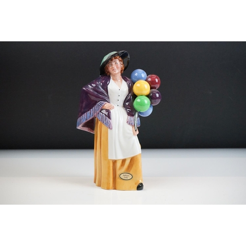 46 - Four Royal Doulton porcelain figures to include the Balloon Lady (HN 2935), The Rag Doll Seller (HN ... 