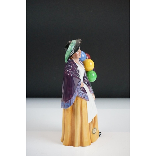 46 - Four Royal Doulton porcelain figures to include the Balloon Lady (HN 2935), The Rag Doll Seller (HN ... 