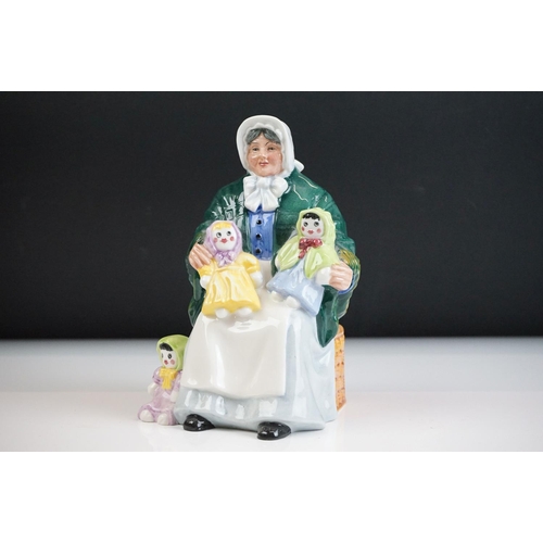 46 - Four Royal Doulton porcelain figures to include the Balloon Lady (HN 2935), The Rag Doll Seller (HN ... 