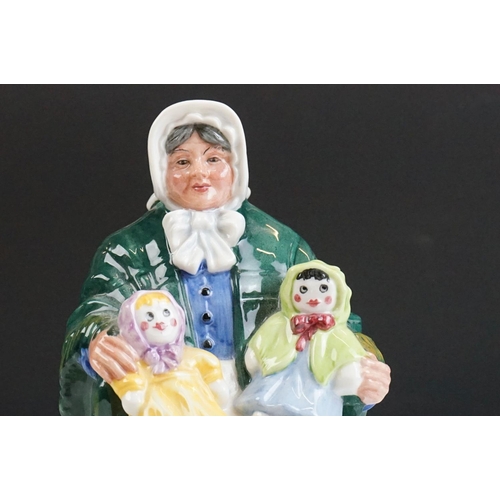 46 - Four Royal Doulton porcelain figures to include the Balloon Lady (HN 2935), The Rag Doll Seller (HN ... 