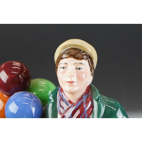 46 - Four Royal Doulton porcelain figures to include the Balloon Lady (HN 2935), The Rag Doll Seller (HN ... 