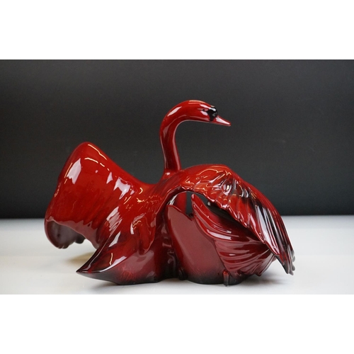 51 - Royal Doulton Flambe Images of Fire ' Nestling Down ' ceramic figure depicting a pair of swans, HN 3... 