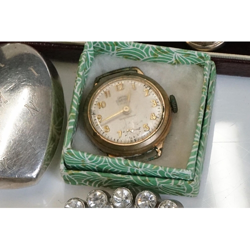 319 - A small collection of watches and vintage costume jewellery to include gold and silver examples.