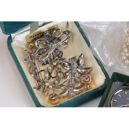 319 - A small collection of watches and vintage costume jewellery to include gold and silver examples.