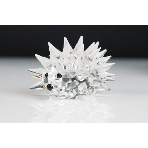 53 - Three Boxed Swarovski Crystal ornaments to include Rose (174596), Cockerel (247759) and Hedgehog, to... 