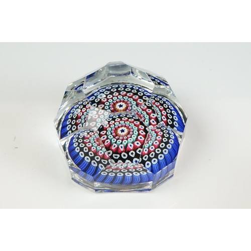 55 - Six Whitefriars faceted glass concentric millefiori paperweights, of varying colours, to include an ... 