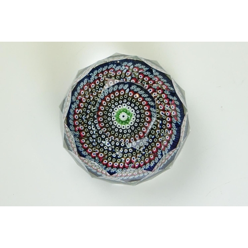 55 - Six Whitefriars faceted glass concentric millefiori paperweights, of varying colours, to include an ... 