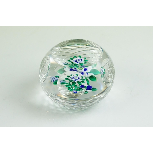 61 - Six glass paperweights to include a John Deacons faceted lamp work pansy & millefiori paperweight (w... 