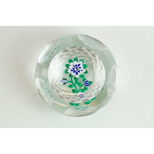 61 - Six glass paperweights to include a John Deacons faceted lamp work pansy & millefiori paperweight (w... 