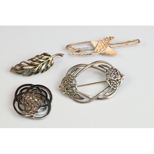 219 - Four silver brooches, to include Flamingo, Fig Leaf & Celtic Knot