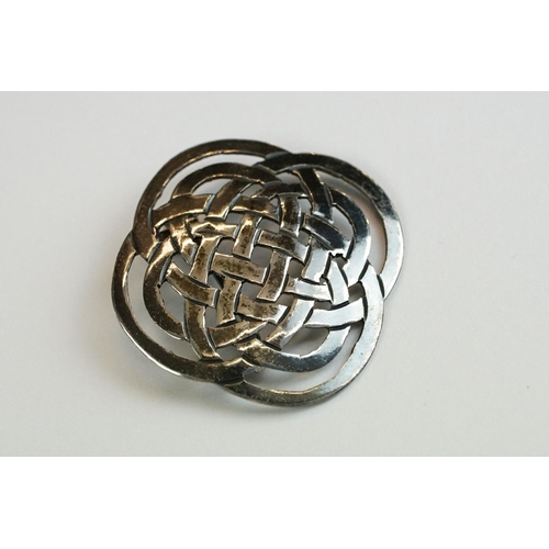 219 - Four silver brooches, to include Flamingo, Fig Leaf & Celtic Knot