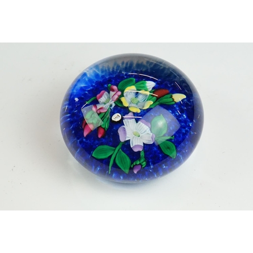 61 - Six glass paperweights to include a John Deacons faceted lamp work pansy & millefiori paperweight (w... 