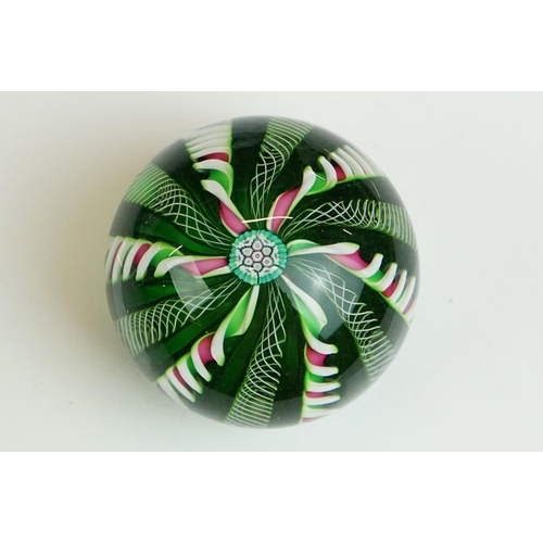 61 - Six glass paperweights to include a John Deacons faceted lamp work pansy & millefiori paperweight (w... 