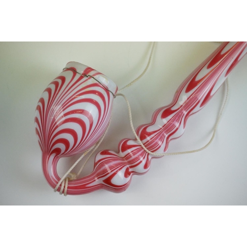 62 - Large Nailsea red and white glass 'bubble' pipe, swirl-effect design, approx 49cm long