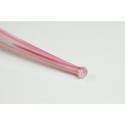 62 - Large Nailsea red and white glass 'bubble' pipe, swirl-effect design, approx 49cm long