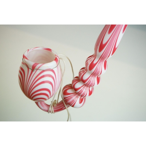 62 - Large Nailsea red and white glass 'bubble' pipe, swirl-effect design, approx 49cm long