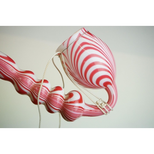 62 - Large Nailsea red and white glass 'bubble' pipe, swirl-effect design, approx 49cm long