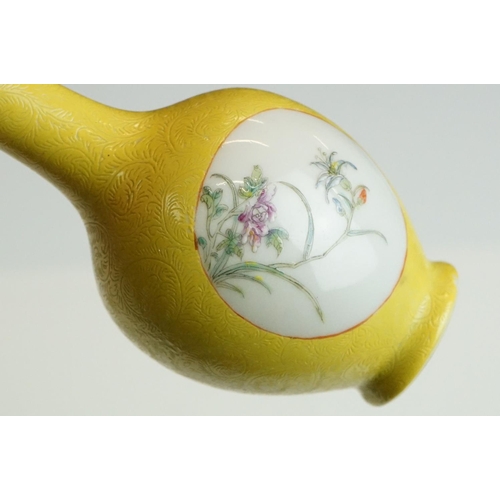 63 - Small Chinese bottle vase with Famille Rose floral panels on a yellow ground with incised scrolling ... 