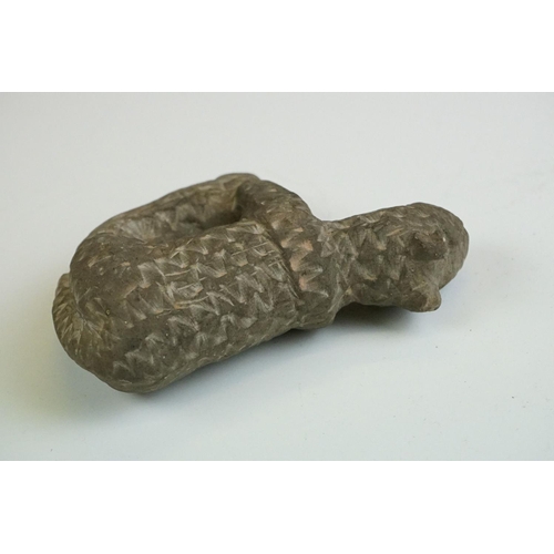 65 - Rustic pottery figure of a cat, in the antique style, with carved effect to surface, 12cm long