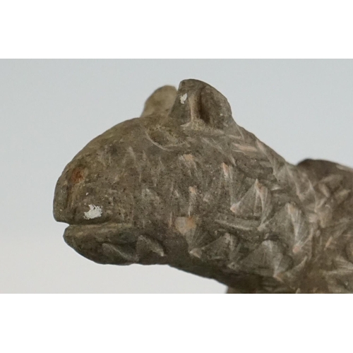 65 - Rustic pottery figure of a cat, in the antique style, with carved effect to surface, 12cm long