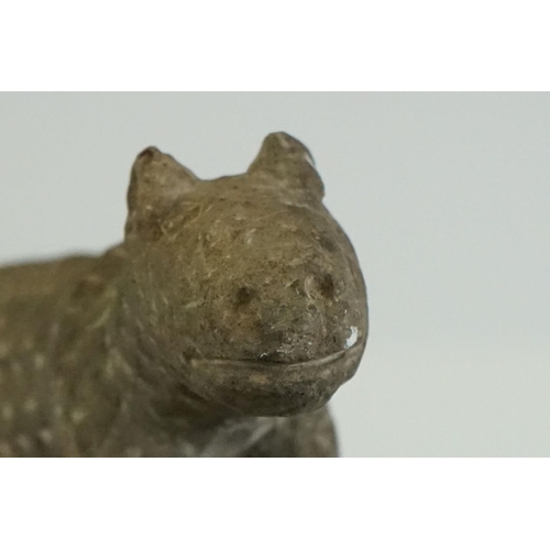 65 - Rustic pottery figure of a cat, in the antique style, with carved effect to surface, 12cm long