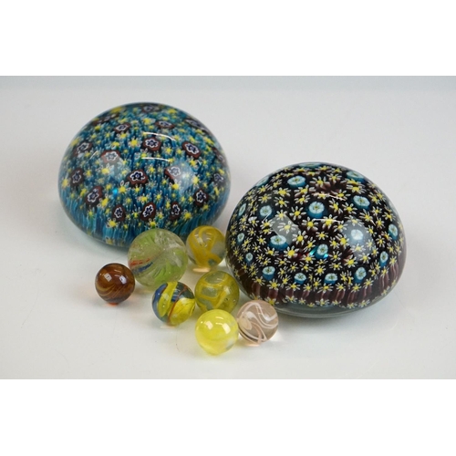 67 - Two Murano millefiori glass paperweights of domed form, 7cm diameter, together with a small group of... 