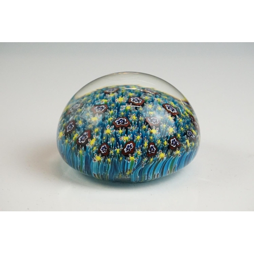 67 - Two Murano millefiori glass paperweights of domed form, 7cm diameter, together with a small group of... 