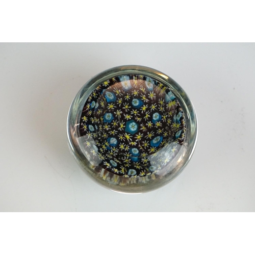 67 - Two Murano millefiori glass paperweights of domed form, 7cm diameter, together with a small group of... 