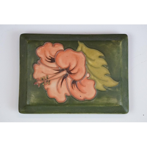 70 - Moorcroft Hibiscus pattern lidded trinket box on green ground, underglaze 'Moorcroft' mark to base, ... 