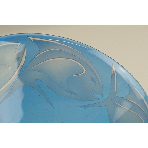 71 - Julia Linstead - Blue overlay studio glass bowl with engraved / etched fish decoration, raised on a ... 