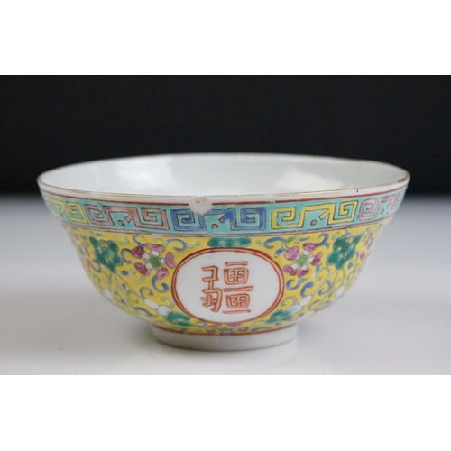 72 - Chinese yellow ground circular bowl with scrolling Famille Rose floral decoration, four character ma... 