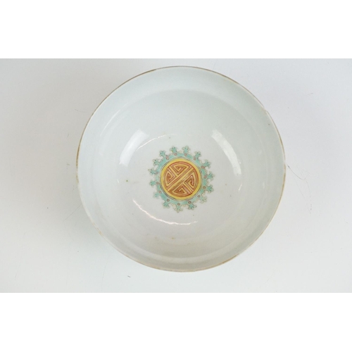 72 - Chinese yellow ground circular bowl with scrolling Famille Rose floral decoration, four character ma... 