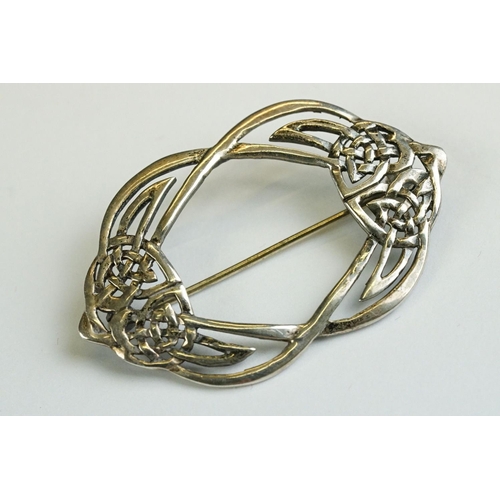 219 - Four silver brooches, to include Flamingo, Fig Leaf & Celtic Knot