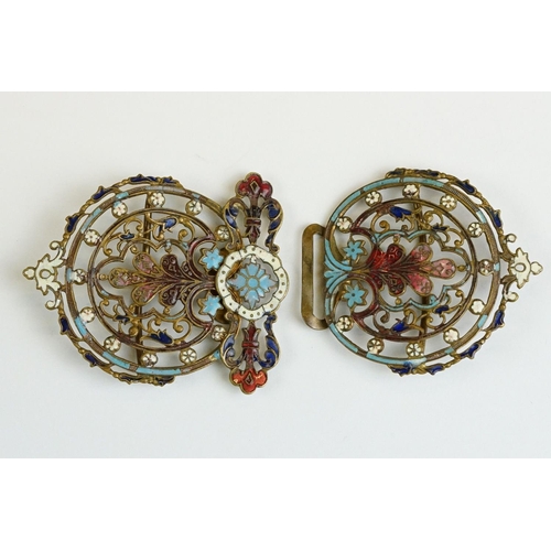 222 - An ornate brass two piece belt buckle with enamel decoration.