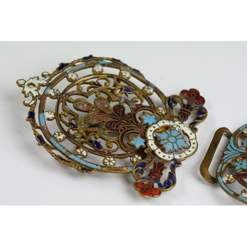 222 - An ornate brass two piece belt buckle with enamel decoration.