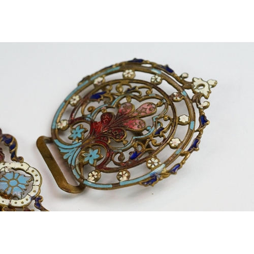 222 - An ornate brass two piece belt buckle with enamel decoration.