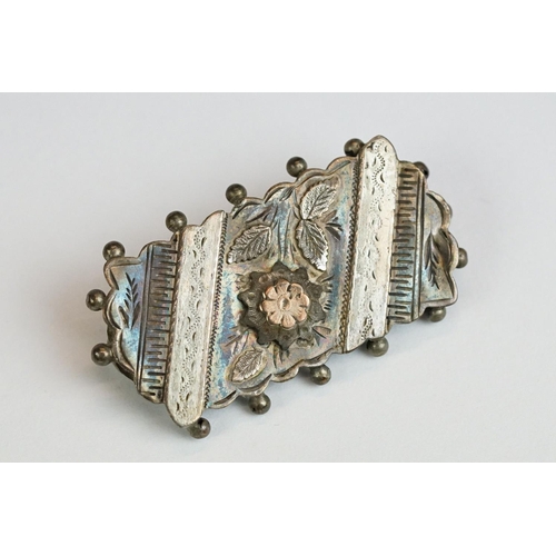 224 - A collection of six Victorian sterling silver brooches with rose gold detailing.