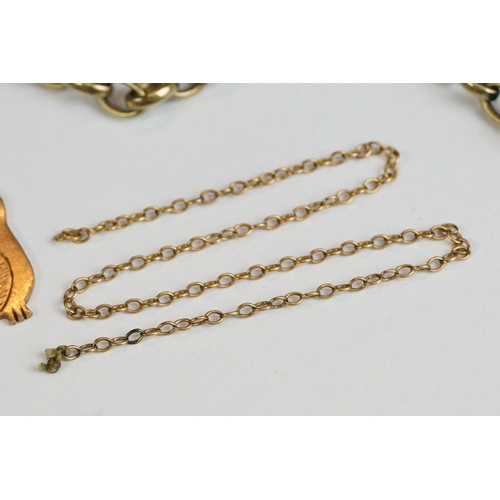 226 - A fully hallmarked 9ct gold owl pendant together with two yellow metal cross pendants and two chains... 