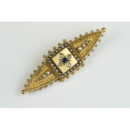 228 - An antique 15ct gold Victorian mourning brooch with filigree and seed pearl decoration and hair pane... 