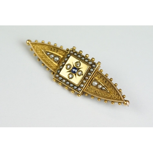 228 - An antique 15ct gold Victorian mourning brooch with filigree and seed pearl decoration and hair pane... 