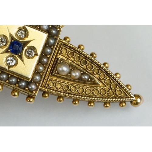 228 - An antique 15ct gold Victorian mourning brooch with filigree and seed pearl decoration and hair pane... 