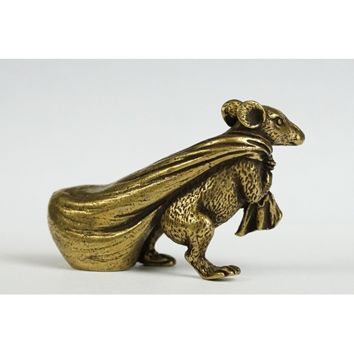 229 - A small brass ornamental Rat carrying bag of wealth figure.