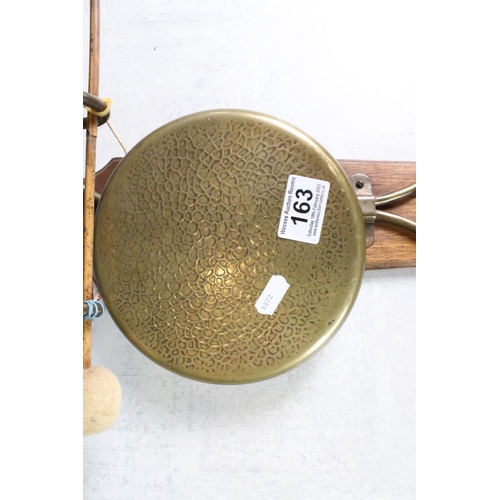 163 - Early 20th Century brass wall mounted circular gong with striker and wooden wall mount (mount measur... 