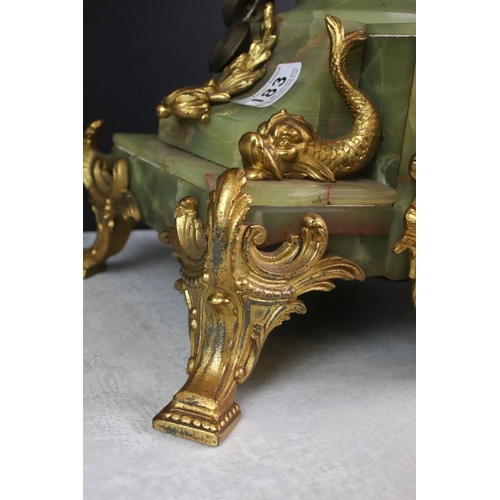 183 - Early 20th Century French onyx clock with applied gilt metal dolphins, the ivorine dial with black A... 