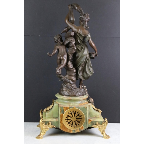 183 - Early 20th Century French onyx clock with applied gilt metal dolphins, the ivorine dial with black A... 