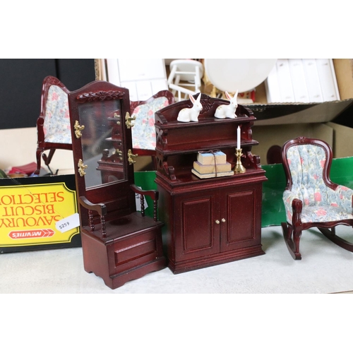 351 - A large three story dolls house  together with associated furniture.