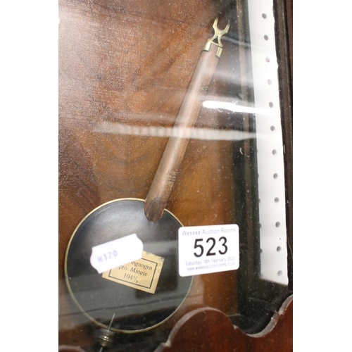 523 - Late Victorian Walnut and Ebonised Wall Clock, the white enamel dial with Arabic numerals, 69cm high